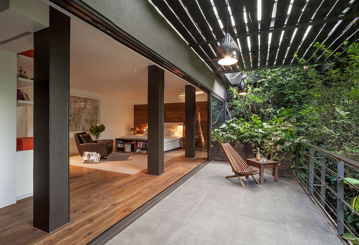 Bedroom-opens-up-completely-to-the-balcony-and-lush-canopy-outside.jpg