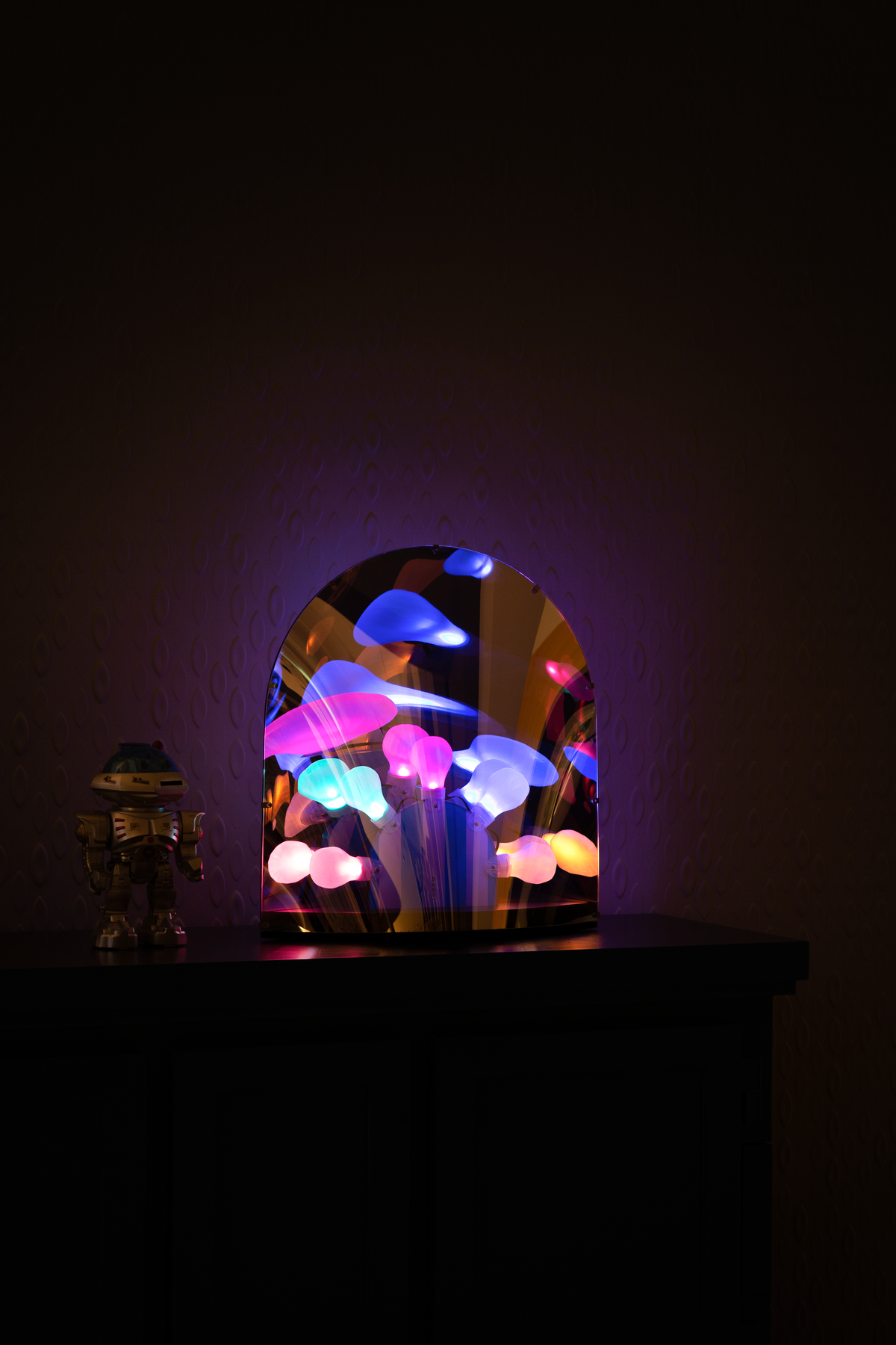 Space-table-lamp-on-cabinet-in-dark-full-color-light